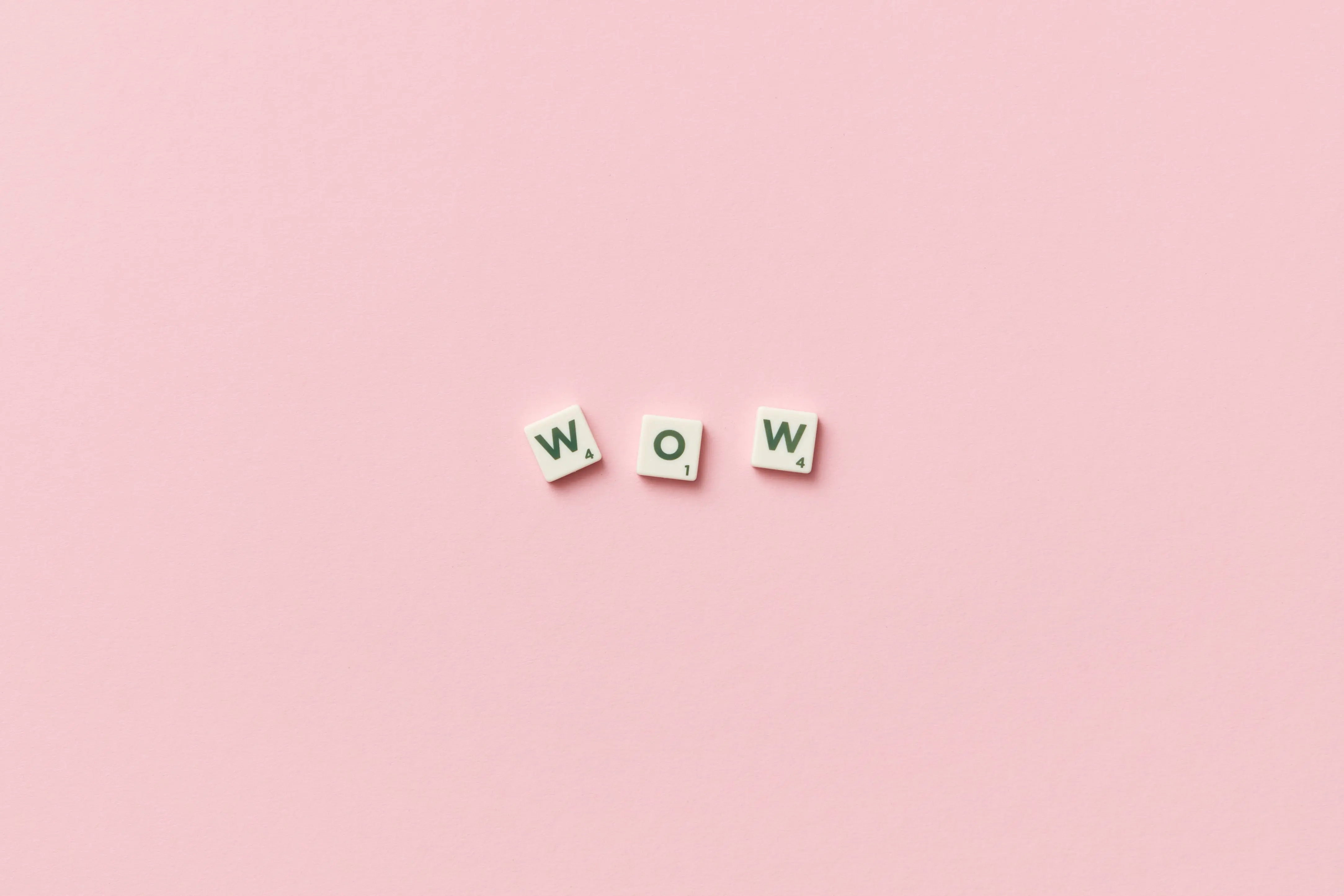 Three Scrabble letters form the word Wow.